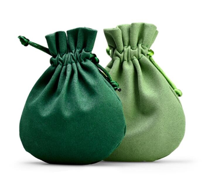De groene Gift van Stoffendrawstring doet de Kleine Ronde Zakken van Fluweeljuwelen in zakken